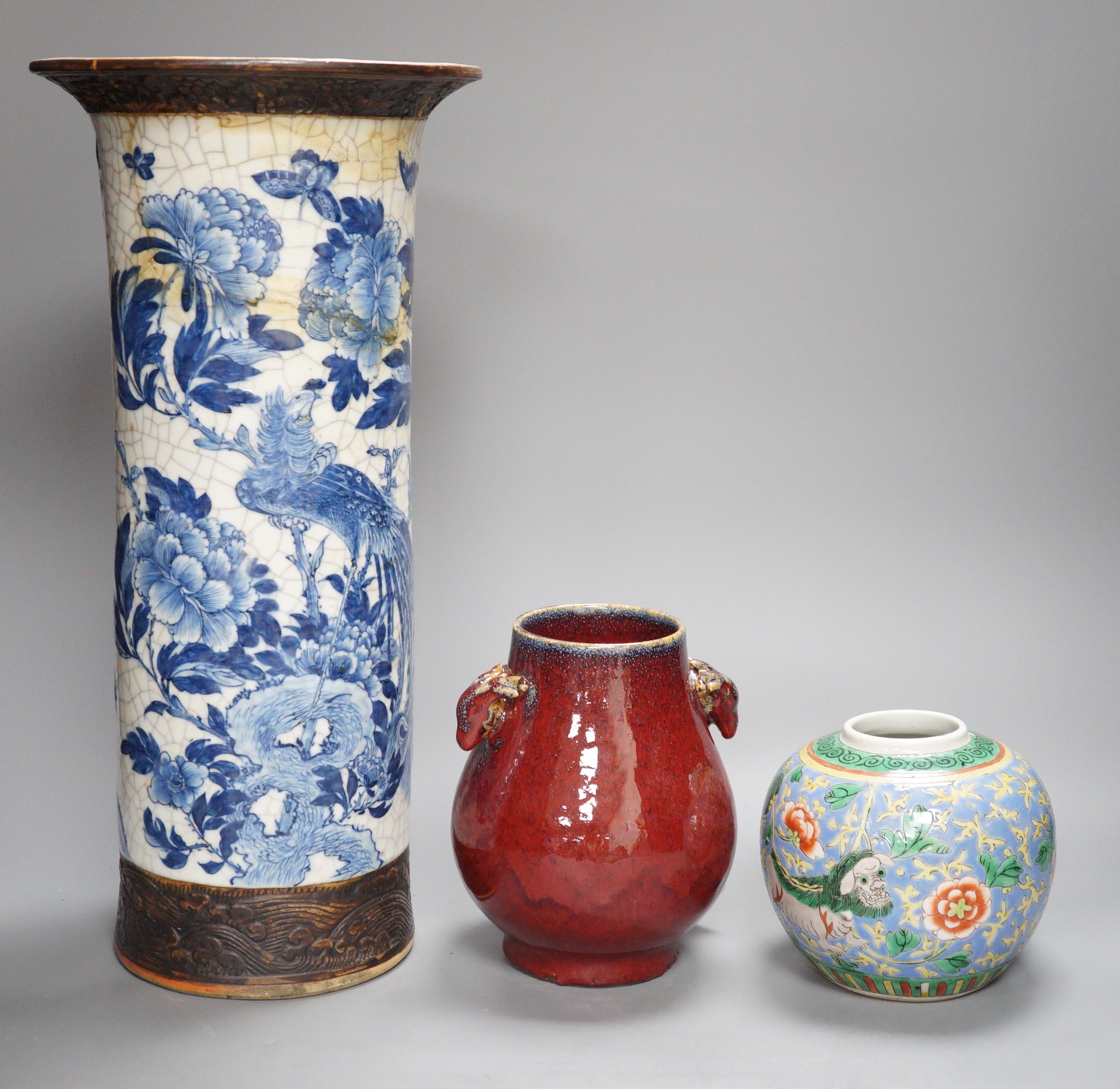 A large Chinese blue and white crackle glaze vase, a sang de boeuf vase and a monochrome jar, tallest 40cm